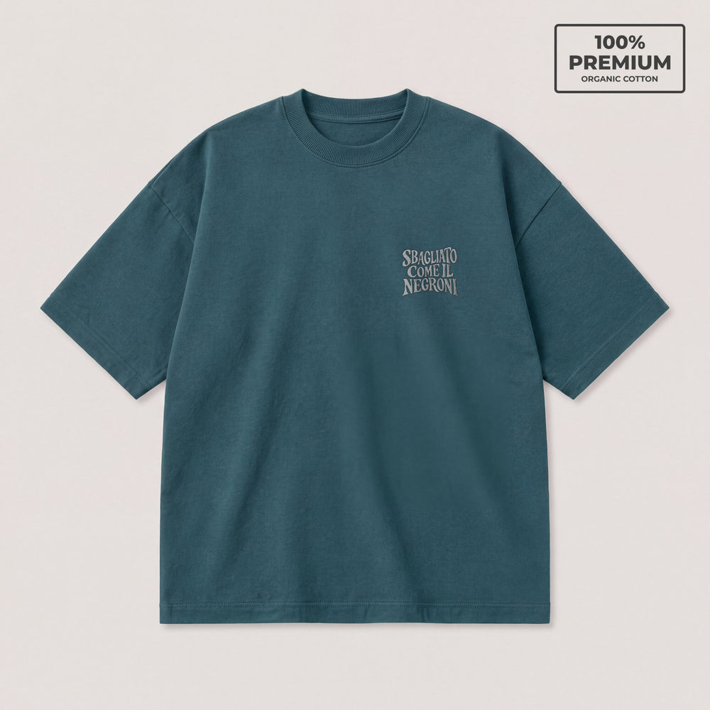 T-shirt oversize petrolio Sbagliato come il Negroni ricamo grigio lato cuore - fronte